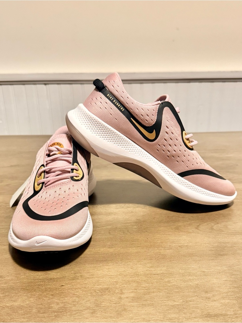 Nike Women’s Pink and Black Slip-On Sneakers with Gold Accents